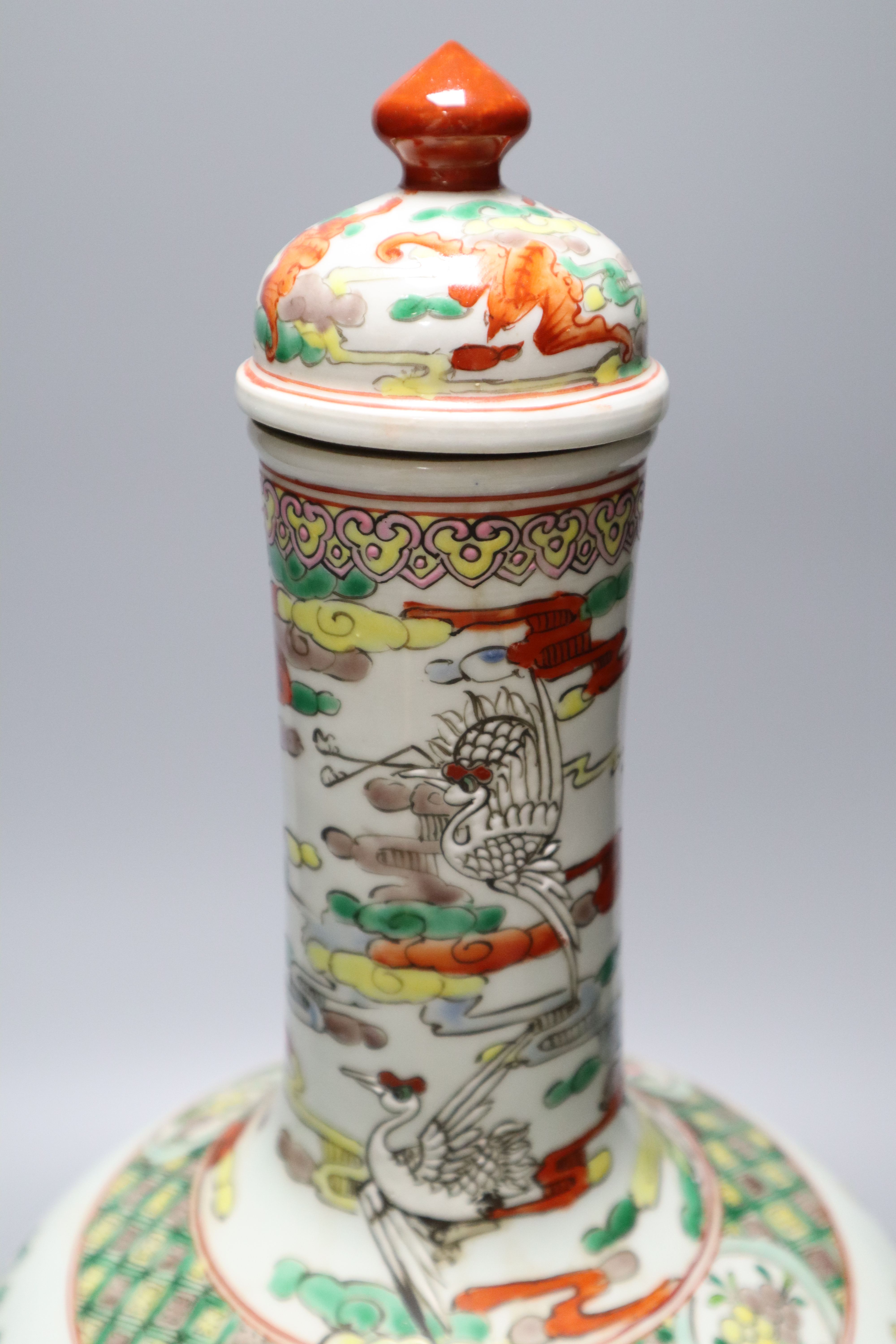 A Chinese famille rose dragon and phoenix bottle vase and cover, 42cm